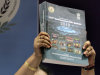 Deputy Comptroller and Auditor General of India Rekha Gupta holds up the audit report on the 2010 Commonwealth Games, during a press conference in New Delhi, India, Friday, Aug. 5, 2011. India's top auditing body on Friday slammed the preparations and conduct of the games last year as deeply flawed, riddled with favoritism and vastly more expensive than planned. (AP Photo/Manish Swarup)