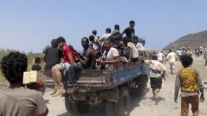 People ride a truck as they loot army depots in Ad &hellip;