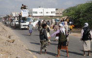 Yemeni residents, who fled nearly eight months of fighting between the army and Islamists, return home in Zinjibar, Yemen, Jan. 14, 2012. (AP Photo/Abdullah al-Sharafy)