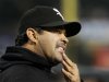 Chicago White Sox manager Ozzie Guillen looks into the stands during a baseball game against the Toronto Blue Jays, Monday, Sept. 26, 2011, in Chicago. Guillen met with owner Jerry Reinsdorf on Monday to discuss his future with the team. No decision was made on whether he will return in 2012. Guillen said he met with Reinsdorf for about 30 minutes. The manager said he made it clear that he would like to come back, but only for a contract extension for more money. (AP Photo/Charles Rex Arbogast)