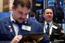 Wall St. touches two-week high on deals, strong earnings