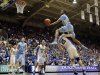 North Carolina's John Henson jumps over Duke's Miles Plumlee (21) for a shot during the first half of an NCAA college basketball game in Durham, N.C., Saturday, March 3, 2012. At rear, Duke's Seth Curry and Austin Rivers (0) watch with North Carolina's Tyler Zeller (44). (AP Photo/Gerry Broome)