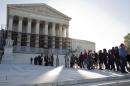People line up to hear oral arguments, including the case Schuette v. Coalition to Defend Affirmative Action, at the Supreme Court in Washington