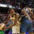 Indiana Fever forward Tamika Catchings, left, looks to pass around Minnesota Lynx guard Monica Wright in the second half of Game 3 of the WNBA basketball Finals, Friday, Oct. 19, 2012, in Indianapolis. The Fever won 76-59. (AP Photo/AJ Mast)