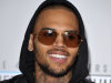 FILE - In this Sunday, Nov. 18, 2012 file photo, Chris Brown arrives at the 40th Anniversary American Music Awards in Los Angeles. According to reports, Monday, Nov. 26, 2012, Brown has taken down his Twitter account after a vulgar, online feud with comedian Jenny Johnson. Johnson says she is now receiving death threats on Twitter from Brown’s supporters. Brown had 11.6 million followers on Twitter. (Photo by John Shearer/Invision/AP, File)