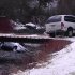 CORRECTS SPELLING OF WILLDEN THROUGHOUT -- A photo provided by Chris Willden shows a car in the Logan River in Utah Saturday Dec. 31, 2011, after the car was flipped upright by rescuers who saved three children trapped in the car.  The car plunged off an embankment into the river and Willden shot out the car's window with a handgun and cut a seat belt to help free the children after the accident.  (AP Photo/Chris Wilden)