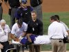 Colorado Rockies starting pitcher Juan Nicasio (44) is taken off the field by medical personnel after Washington Nationals' Ian Desmond hit him in the head with a line drive during the second inning of a baseball game Friday, Aug. 5, 2011, in Denver. (AP Photo/Barry Gutierrez)