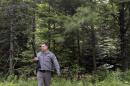 A law enforcement official stands guard on Studley Road where the search for convicted murderer David Sweat continues, Saturday, June 27, 2015, in Duane, N.Y. Convicted murderer Richard Matt was shot and killed by a Border Patrol agent in a wooded area about 30 miles from the Clinton Correctional Facility on Friday. Sweat is on the run, authorities said. (AP Photo/Mary Altaffer)