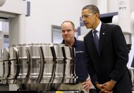 President Barack Obama looks at a aircraft component with employee Robert Abernathy during his tour of the Rolls-Royce Crosspointe jet engine disc manufacturing facility, Friday, March, 9, 2012, in Prince George, Va. (AP Photo/Pablo Martinez Monsivais)