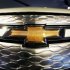 A Chevrolet logo is seen on the front of a Volt electric vehicle during the press days for the North American International Auto show in Detroit