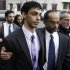 Dharun Ravi, center, is helped by his father, Ravi Pazhani, second right, as they leave court around  in New Brunswick, N.J., Friday, March 16, 2012. Defense attorney Philip Nettl follows, second left.  Ravi, a former Rutgers University student accused of using a webcam to spy on his gay roommate's love life has been convicted of bias intimidation and invasion of privacy. A jury found that he used a webcam to spy on roommate Tyler Clementi.  Within days, Clementi realized he had been watched and jumped to his death from New York's George Washington Bridge in September 2010.   (AP Photo/Mel Evans)
