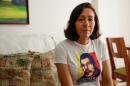 Elky Arellano, wearing a t-shirt depicting her husband Marcelo Crovato, poses for a photo during an interview with Reuters in Caracas