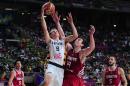 Turkey's Omer Asik, second right, vies for the ball against Lithuania's Renaldas Seibutis, second left, during Basketball World Cup quarter finals between Lithuania and Turkey at the Palau Sant Jordi in Barcelona, Spain, Tuesday, Sept. 9, 2014. The 2014 Basketball World Cup competition will take place in various cities in Spain from Aug. 30 through to Sept. 14. (AP Photo/Manu Fernandez)