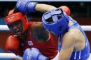 FILE - In this Aug. 9, 2012, file phto, Claressa Shields, of the United States, in red, fights Russia's Nadezda Torlopova, in blue, in a women's middleweight 75-kg boxing gold medal match at the 2012 Summer Olympics. The next wave of women's boxing has arrived in Rio de Janeiro to build on the momentum of the inaugural Olympic tournament in London. (AP Photo/Patrick Semansky, File)