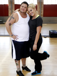 In this Sept. 7, 2011 photo, Chaz Bono, left, and his dance partner Lacey Schwimmer pose during their rehearsal for the upcoming season of "Dancing of the Stars" in Los Angeles. The new season of "Dancing with the Stars" premieres Monday, Sept. 19 on ABC. (AP Photo/Matt Sayles)