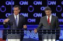 FILE - In this Oct. 18, 2011, file photo Republican presidential candidates Mitt Romney and Rick Perry, right, spar during a Republican presidential debate in Las Vegas. Perry, still nursing wounds from his failed presidential campaign, did himself a world of good with his self-deprecating jokes at a dinner in Washington in March. First, he joked that his time as the GOP front-runner had been 
