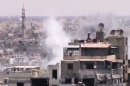 This image made from amateur video released by the Shaam News Network and accessed Monday, June 18, 2012, purports to show smoke rising from buildings in Homs, Syria. Syrian forces renewed shelling of the central city of Homs on Monday, one day after the head of the U.N. observers' mission demanded that warring parties allow the evacuation of women, children, elderly and sick people, activists said. (AP Photo/Shaam News Network via AP video) TV OUT, THE ASSOCIATED PRESS CANNOT INDEPENDENTLY VERIFY THE CONTENT, DATE, LOCATION OR AUTHENTICITY OF THIS MATERIAL