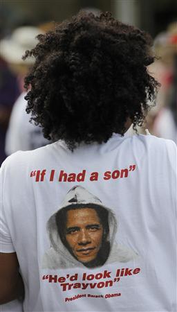 A member of the crowd wears a t-shirt with an image of President Obama during a rally for Trayvon Martin in Miami