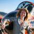 This photo provided by the National Championship Air Races shows Heather Penney in front of the race jet "Ragu Grace", in Reno, Nev.. Fighter pilot Heather "Lucky" Penney didn't have time to be scared. There was a hijacked commercial airliner headed to Washington, D.C., and she was ordered to stop it. On Sept. 11, 2001, Penney and her commanding officer were ordered to stop United Airlines Flight 93 from hitting a target in the nation's capital. But they didn't have any missiles or even ammunition. So Col. Marc Sasseville decided they would use their own planes to bring it down.  (AP Photo/National Championship Air Races, Tyson Rininger)