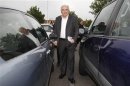 Former IMF head Strauss-Kahn arrives at a polling station in the second round of the 2012 French presidential elections in Sarcelles