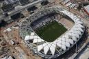 FILE - This Dec. 10, 2013 file photo shows an aerial view of the Arena da Amazonia stadium in Manaus, Brazil. A worker was injured in an accident outside this World Cup stadium, local organizers said Friday, Feb. 7, 2014. Organizers in charge of the stadium's construction said the worker was hurt while dismantling a crane that was used to install the roof. (AP Photo/Renata Brito, File)