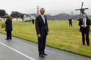 U.S. President Obama smiles as he prepares to board Marine One to a Democratic fund raiser in San Francisco