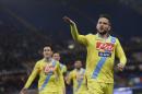 Napoli's Dries Mertens right celebrates after scoring during an Italian Cup, semifinal first leg match, between AS Roma and Napoli at Rome's Olympic stadium, Wednesday, Feb. 5, 2014. (AP Photo/Alessandra Tarantino)