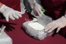 Criminology specialists test cocaine seized in Venezuela, on April 25, 2013