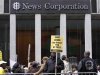 Protesters march outside the News Corp. headquarters in New York