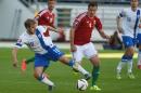 Teemu Pukki of Finland, left, and Daniel Tozser of Hungary in action during their UEFA EURO 2016 phase 1 qualification match between Finland and Hungary at the Helsinki Olympic Stadium on Saturday June 13, 2015. (Jussi Nukari/Lehtikuva via AP) FINLAND OUT - NO SALES