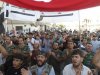 Members of the Free Syrian Army and residents shout slogans during a protest against Syria's President Bashar al-Assad in Sermada near Idlib