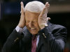 FILE - In this March 17, 2005 file photo, then-Arizona head coach Lute Olson reacts to a turnover against Utah State during the first half of a first-round game in the NCAA college basketball tournament in Boise, Idaho. The former Arizona coach contends in a lawsuit that he lost slightly more than $1 million by investing in "bogus" bonds with David Salinas, the Houston financial adviser for college coaches who committed suicide while under investigation by the Securities and Exchange Commission. (AP Photo/Douglas C. Pizac, File)