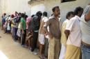 Sri Lankan asylum seekers who were sent back by Australia wait to enter a magistrate's court in Galle
