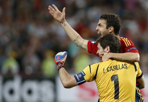 Spain's Fabregas celebrates with goalkeeper Casillas after scoring the winning penalty goal against Portugal during the penalty shoot-out in their Euro 2012 semi-final soccer match at the Donbass Arena in Donetsk