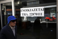 <p> An elderly man passes an empty closed shop with a sign reading in Greek " To rent" in central Nicosia, Cyprus, Tuesday, April 9, 2013. Last month, Cyprus agreed that bondholders, investors and savers with more than 100,000 euros in the country's two largest — and most troubled — banks will take significant losses in exchange for a 10 billion euro ($13 billion) rescue package. (AP Photo/Petros Karadjias)