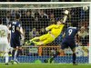 Real Madrid's goalkeeper and captain Iker Casillas tries to stop a goal of Malaga's Santiago Cazorla