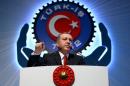 Turkey's President Tayyip Erdogan addresses the audience during a meeting in Ankara