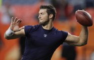 FILE - In this Nov. 17, 2011 file photo, Denver Broncos quarterback Tim Tebow warms up before playing the New York Jets in an NFL football game, in Denver. Tebow has been traded from the Denver Broncos to the New York Jets. (AP Photo/Barry Gutierrez, File)