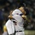 Detroit Tigers' Jose Valverde, right, lifts catcher Alex Avila as they celebrate on the mound after the Tigers clinched the AL Central Division title at the end of a baseball game against the Oakland Athletics, Friday, Sept. 16, 2011, in Oakland, Calif. (AP Photo/Ben Margot)