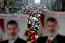 Supporters of deposed Egyptian President Mohamed Mursi shout slogans during a march from Al-Fath Mosque to the defence ministry, in Cairo
