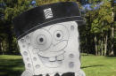 In this Thursday, Oct. 10, 2013, photo provided by the family of Kimberly Walker, shows Walker's gravestone in the likeness of popular cartoon character SpongeBob SquarePants. Despite getting prior approval for the gravestone from Spring Grove Cemetery in Cincinnati, the cemetery recently removed it, saying it did not fit in with the character of the historic and picturesque cemetery. (AP Photo/Kara Walker)