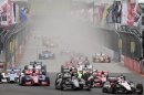 IndyCar driver Will Power, of Australia, right, leads the pack during the start of the IndyCar Sao Paulo 300 in Sao Paulo, Brazil, Sunday, April 29, 2012. (AP Photo/Andre Penner)