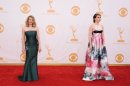 Anna Chlumsky and Zosia Mamet, right, arrive at the 65th Primetime Emmy Awards at Nokia Theatre on Sunday, Sept. 22, 2013, in Los Angeles. (Photo by Jordan Strauss/Invision/AP)