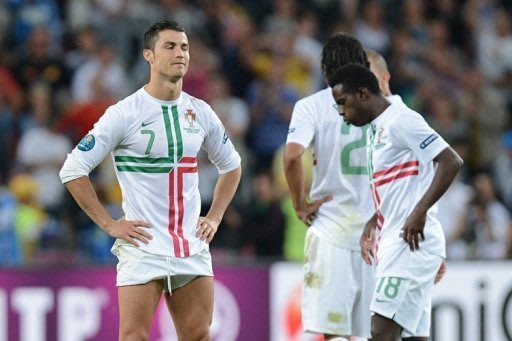 Portuguese forwards Cristiano Ronaldo and Silvestre Varela look dejected at the end of the match
