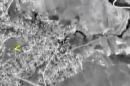 In this photo made from the footage taken from Russian Defense Ministry official web site on Thursday, Oct. 1, 2015 a bomb explosion is seen in Syria. Reacting to criticism that it is targeting opponents of the Syrian government, a spokesman for Russian President Vladimir Putin admitted on Thursday that Russia's airstrikes in Syria are targeting not only Islamic State militants but also other groups. (AP Photo/ Russian Defense Ministry Press Service)