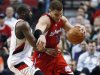 Los Angeles Clippers' Blake Griffin (32) drives past Portland Trail Blazers' Raymond Felton (5) in the second quarter of an NBA basketball game Thursday, Feb. 16, 2012, in Portland, Ore. (AP Photo/Rick Bowmer)