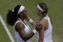 Serena Williams of the United States talks to Victoria Azarenka of Belarus, after defeating her in their singles match, at the All England Lawn Tennis Championships in Wimbledon, London, Tuesday July 7, 2015. Williams won 3-6, 6-2, 6-3. (AP Photo/Pavel Golovkin)