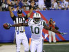 New York Jets' Santonio Holmes celebrates his touchdown during the second quarter of an NFL preseason football game against the New York Giants, Monday, Aug. 29, 2011, in East Rutherford, N.J. (AP Photo/Bill Kostroun)