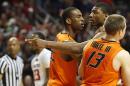Oklahoma State's Markel Brown(22) and Phil Forte(13) hold Marcus Smart(33) after Smart shoved a fan during their NCAA college basketball game in Lubbock, Texas, Saturday, Feb, 8, 2014. (AP Photo/Lubbock Avalanche-Journal, Tori Eichberger) ALL LOCAL TV OUT