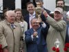 Orb trainer McGaughey holds up the Kentucky Derby trophy with horse owners Janney and Phipps after the running of the 139th Kentucky Derby horse race at Churchill Downs in Louisville